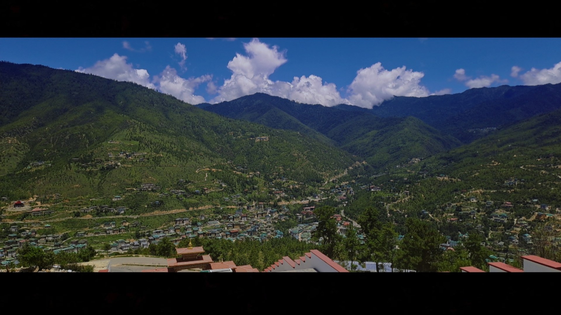 Thimphu unfolding across its forested valley
